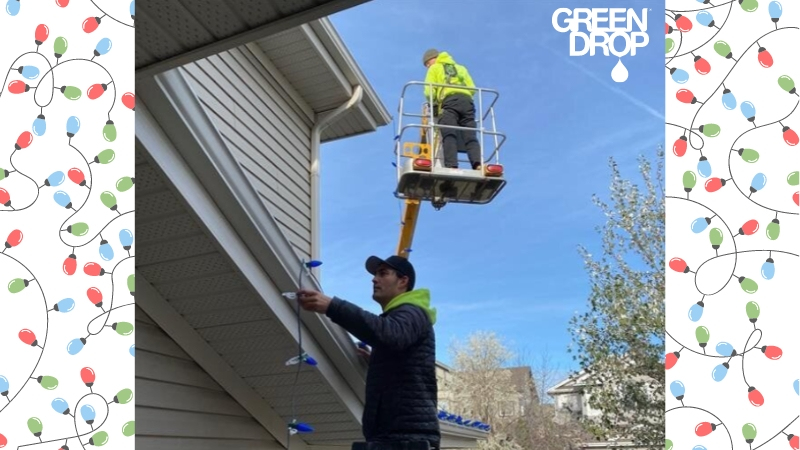 Green Drop workers putting up holiday lights